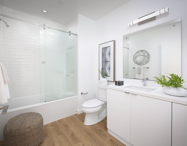 Cielo Apartments: Modern bathroom with sleek fixtures and lighting