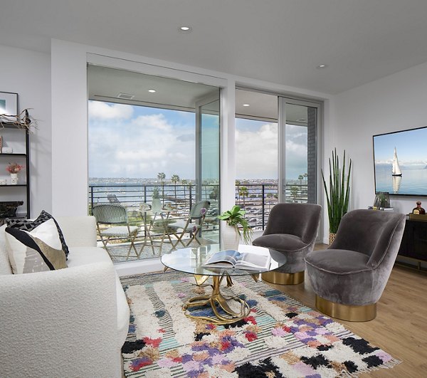 Spacious living room with modern furnishings and city views at Cielo Apartments, offering luxury living in Greystar's premier property