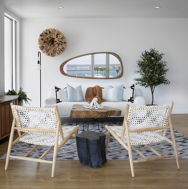 Contemporary living room with modern decor at Cielo Apartments, featuring a cozy seating area and elegant lighting