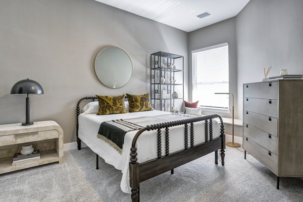 Cozy bedroom with modern decor at Prime Apartments