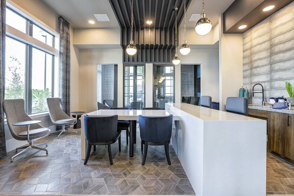 Clubhouse at Prime Apartments featuring luxurious furnishings and community space, ideal for social gatherings and relaxation