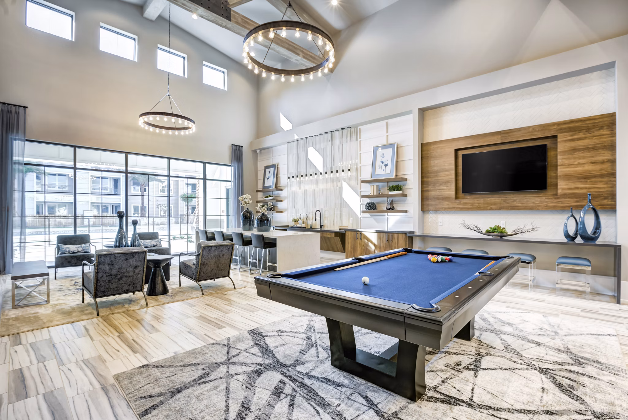 Clubhouse with modern dÃ©cor and seating at Prime Apartments, a luxury community offering upscale amenities for residents