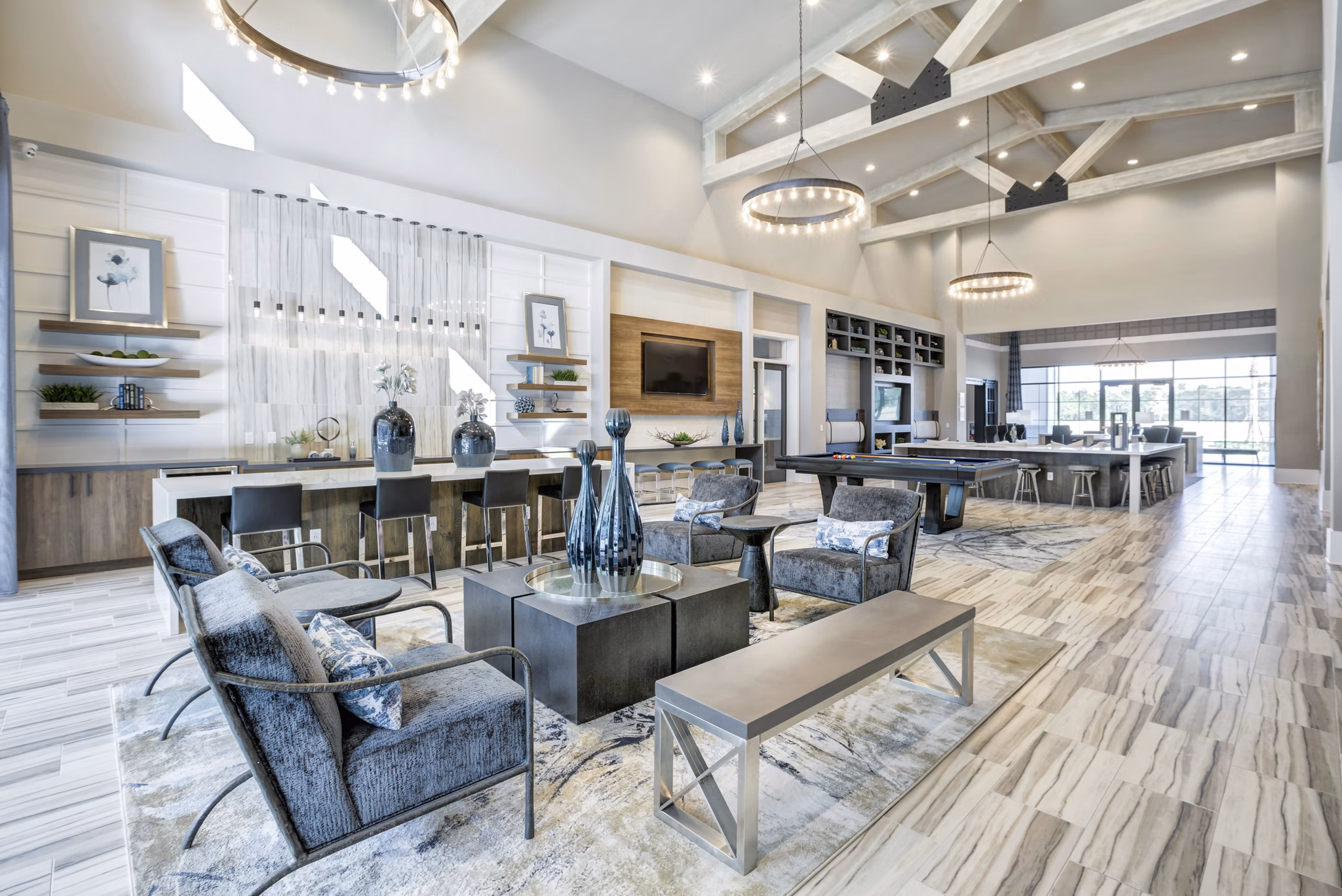 Clubhouse at Prime Apartments featuring modern lounge seating and entertainment areas