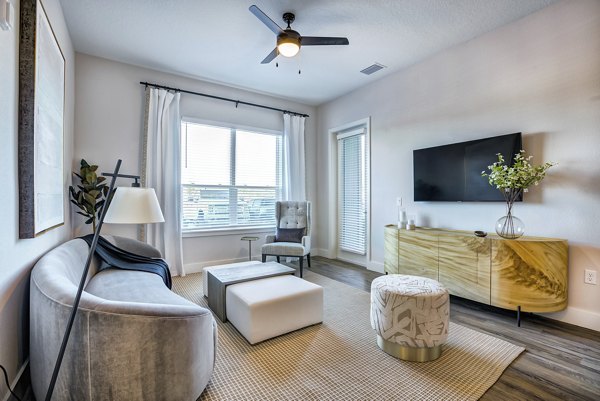 Contemporary living room with plush seating and stylish decor in Prime Apartments