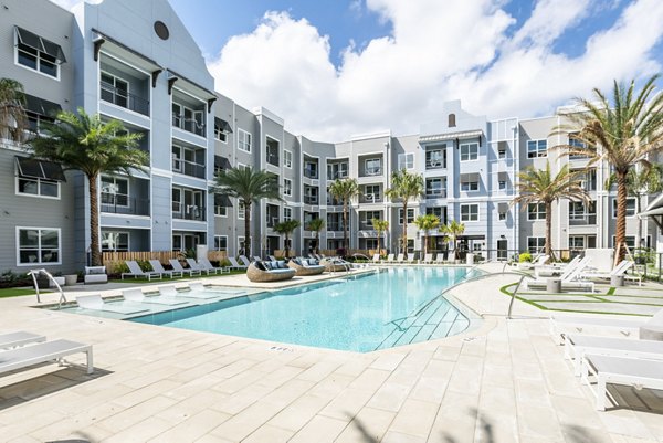 Luxurious outdoor pool area at Prime Apartments offering relaxation and leisure for residents