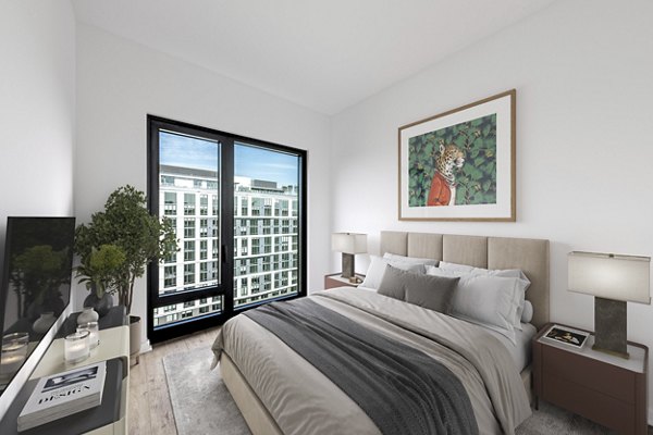 Bedroom with modern decor features at The Gantry Apartments, luxury living by Greystar