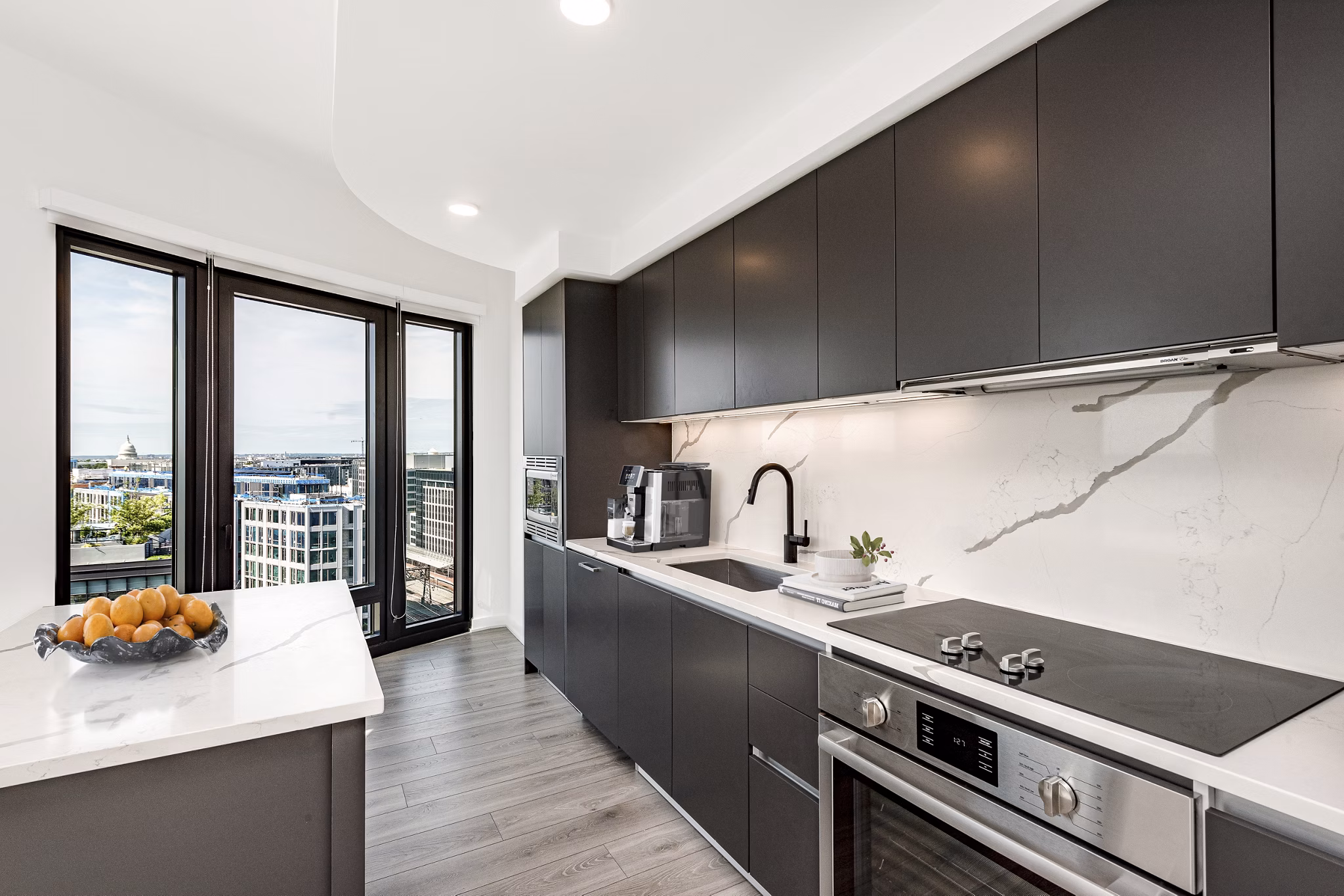 Modern kitchen with stainless steel appliances at The Gantry Apartments