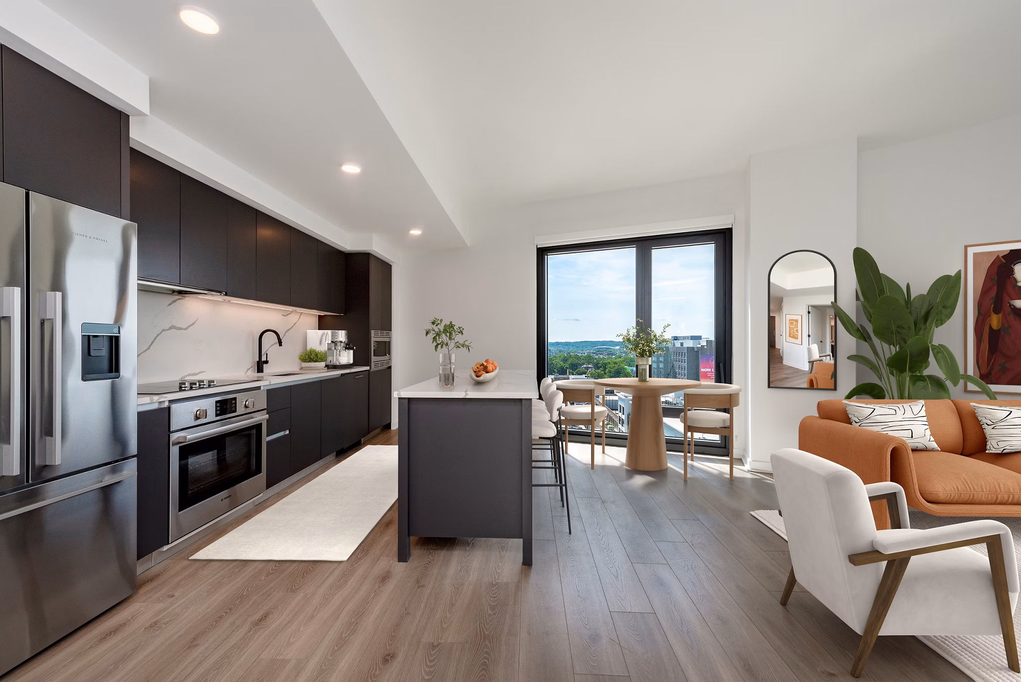 Modern kitchen featuring stainless steel appliances and quartz countertops at The Gantry Apartments