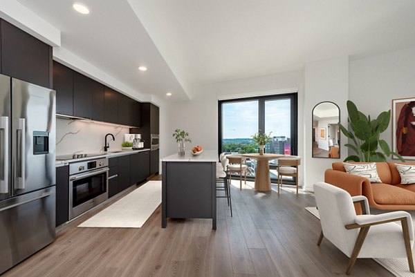 Modern kitchen featuring stainless steel appliances and quartz countertops at The Gantry Apartments