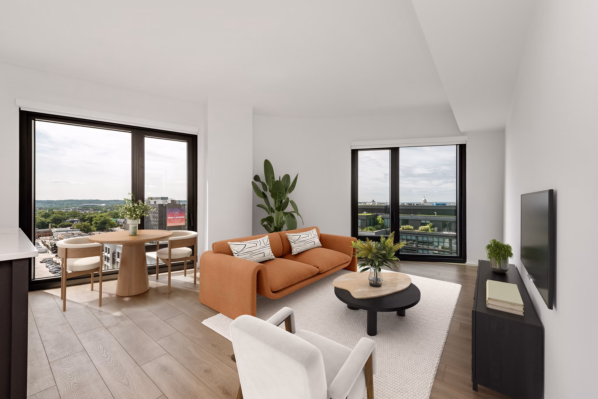 Spacious living room with modern decor and large windows at The Gantry Apartments, luxury living by Greystar