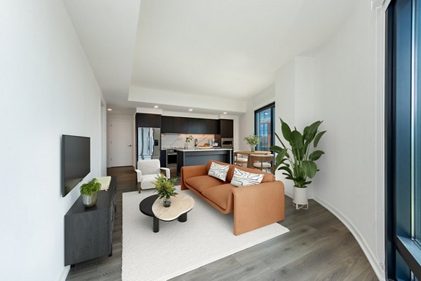 Living room featuring contemporary furnishings and natural light at The Gantry Apartments, luxury living in a vibrant community