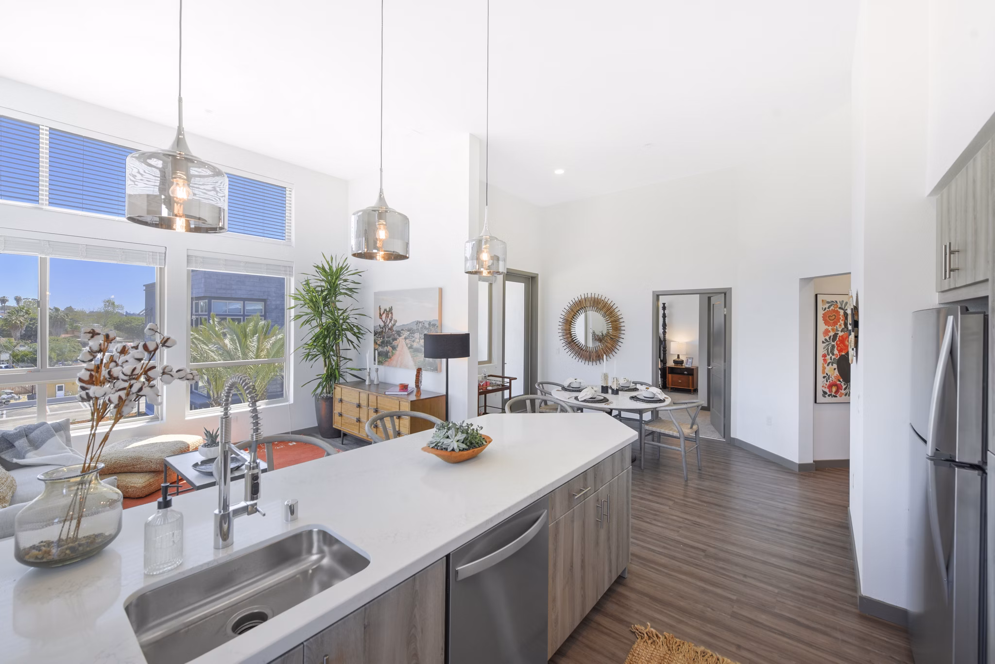 Modern kitchen featuring stainless appliances and granite countertops at Persea Apartments luxury living community