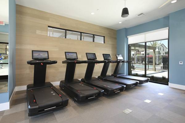 fitness center at The Strand Apartments