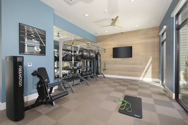 fitness center at The Strand Apartments