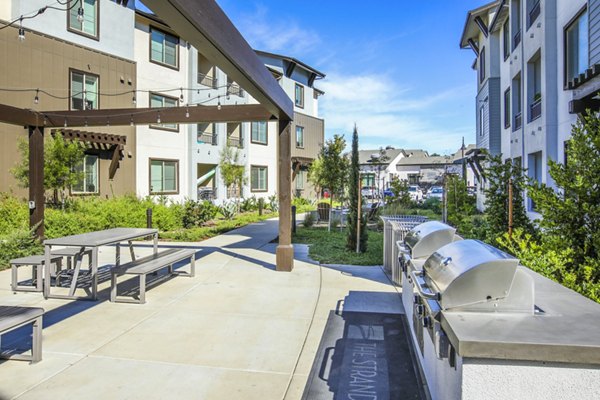 grill area/patio at The Strand Apartments