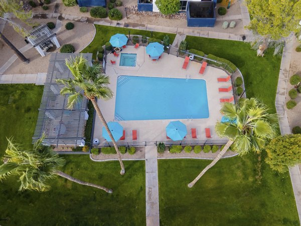 Sparkling outdoor pool at Vida46 Apartments with luxury amenities for relaxation and recreation