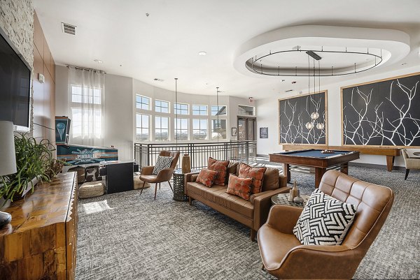 clubhouse fireplace lounge area at at Arvada Station Apartments