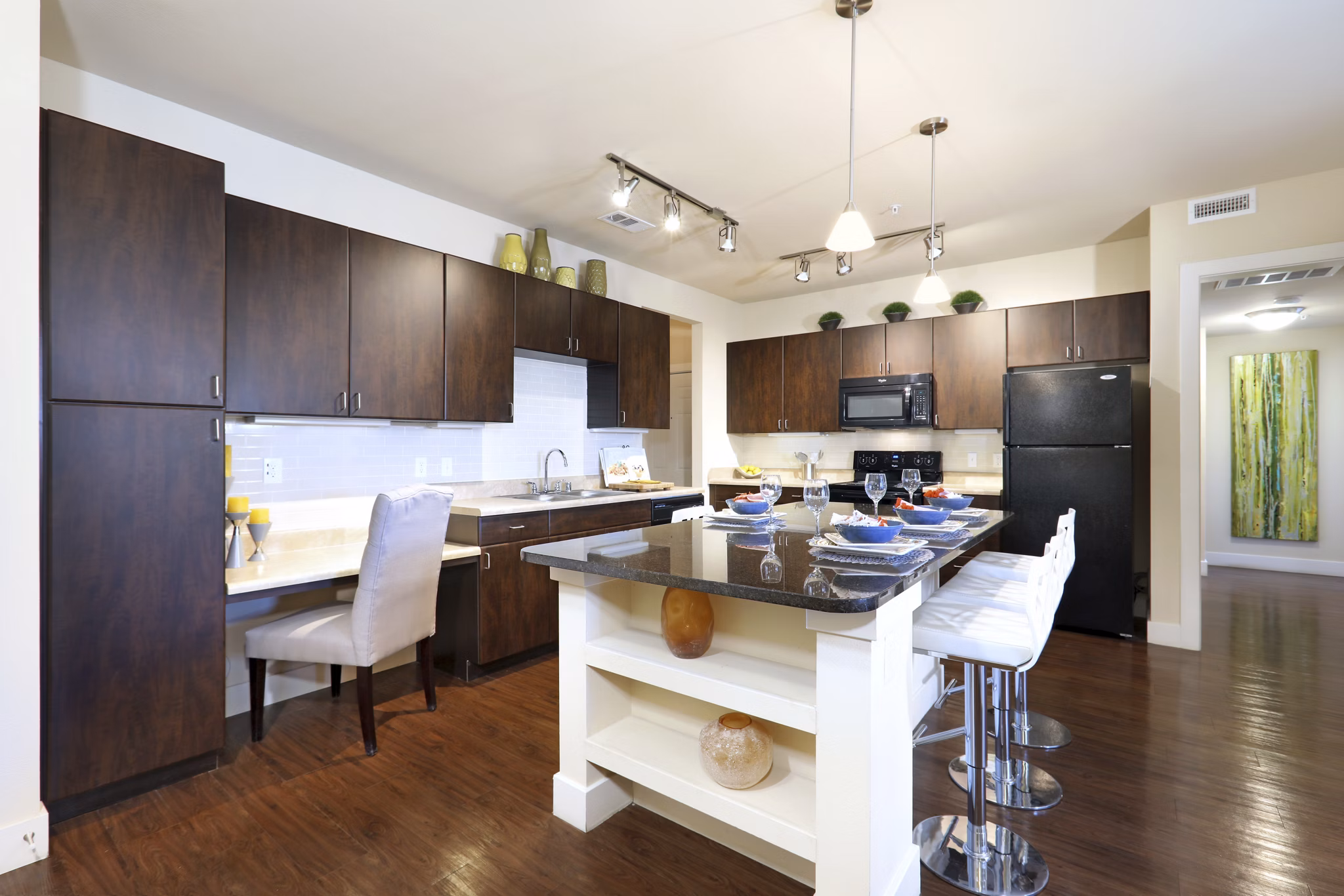 Kitchen with modern appliances and island at Arvada Station Apartments â€“ luxury living offered by Greystar Luxury Apartments