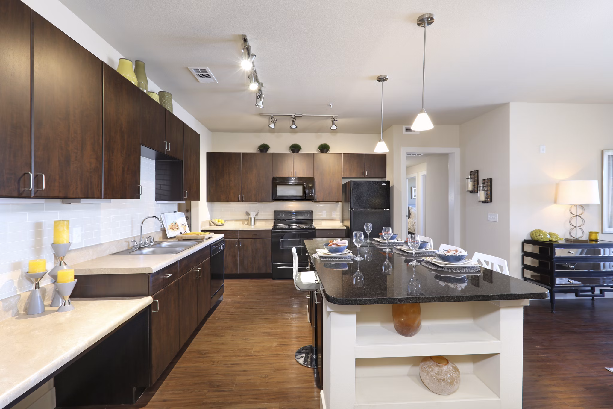 Modern kitchen with stainless steel appliances at Arvada Station Apartments luxury community