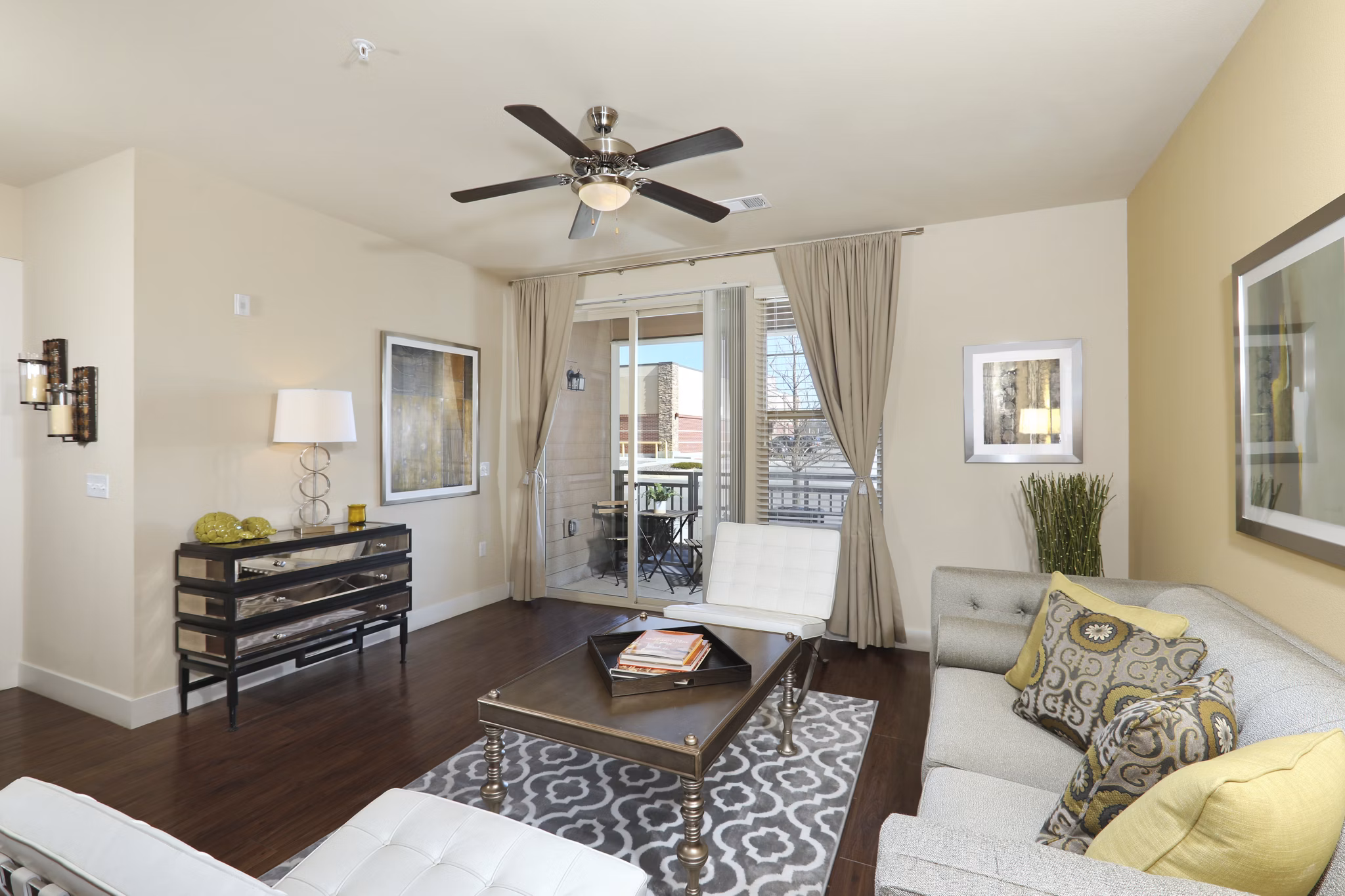 Stylish living room with modern decor and natural lighting at Arvada Station Apartments