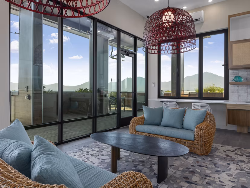 Clubhouse with modern decor and seating at Upper West Apartments