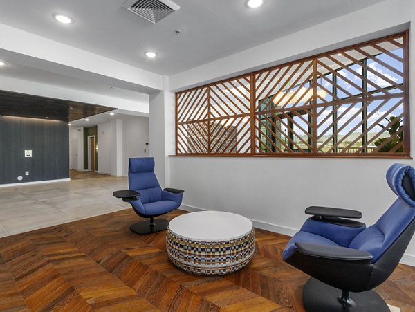 Clubhouse with modern design and comfortable seating at Upper West Apartments, a Greystar luxury property