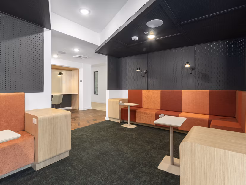 Clubhouse with stylish seating and modern decor at Upper West Apartments