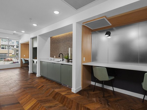 Clubhouse featuring modern design and communal seating at Upper West luxury apartments