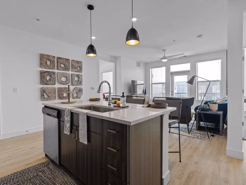 Modern kitchen with stainless steel appliances in Upper West Apartments