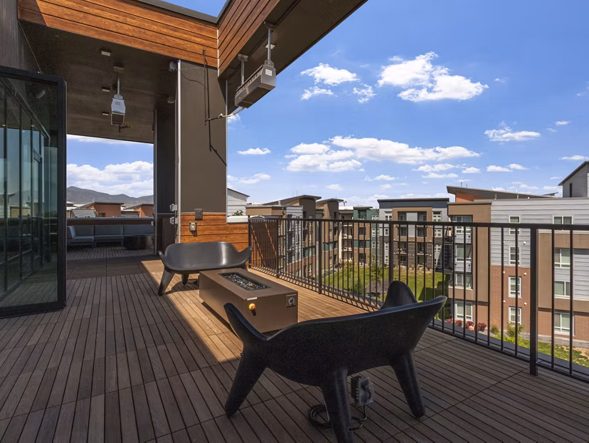 Inviting outdoor fire pit area at Upper West Apartments, ideal for relaxation and social gatherings