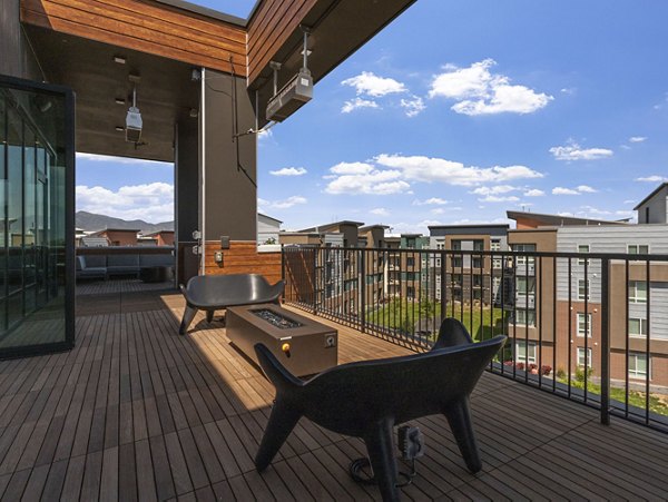Inviting outdoor fire pit area at Upper West Apartments, ideal for relaxation and social gatherings