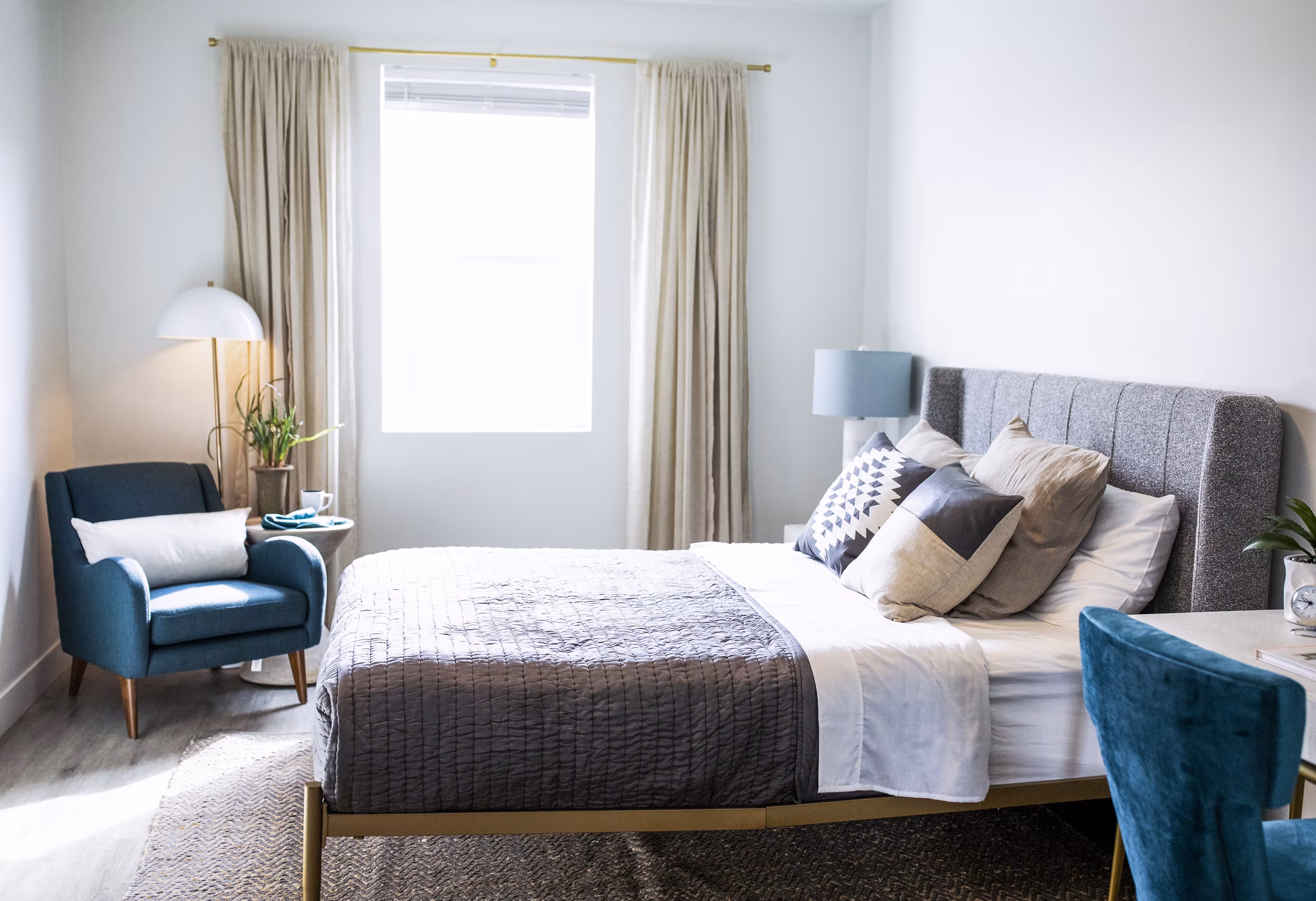 Spacious bedroom with modern decor at Mirella at Foxboro Apartments luxury community