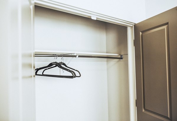 Walk-in closet with built-in shelves in Mirella at Foxboro Apartments