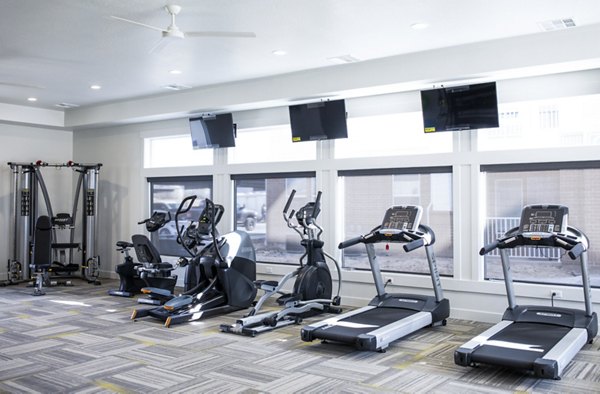 State-of-the-art fitness center at Mirella at Foxboro Apartments featuring modern equipment and spacious workout areas