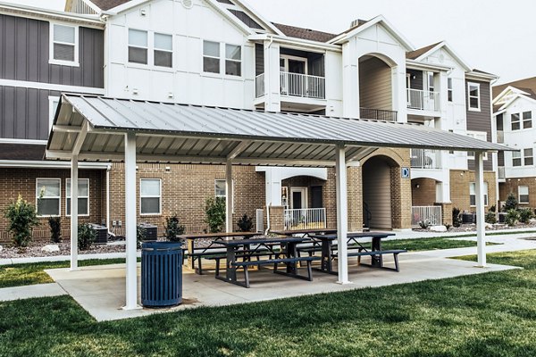 Outdoor patio area with modern seating at Mirella at Foxboro Apartments