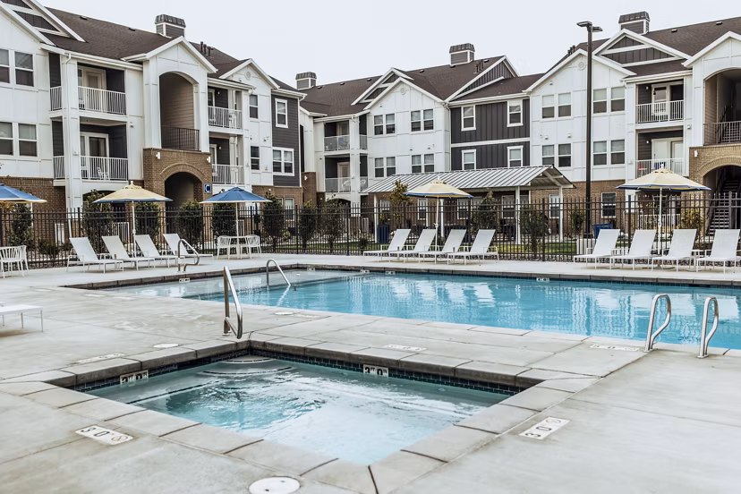 Hot tub oasis at Mirella at Foxboro Apartments with built-in jets and a relaxing ambiance