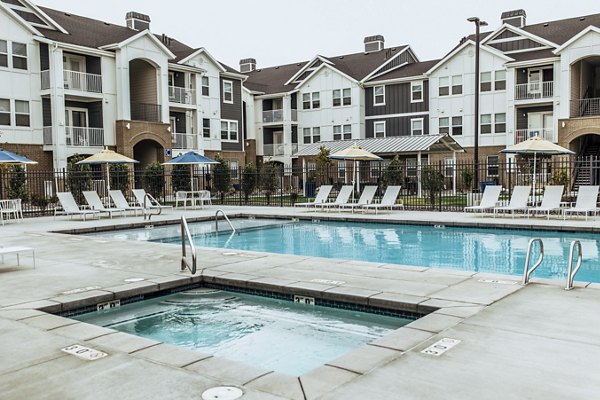 Hot tub oasis at Mirella at Foxboro Apartments with built-in jets and a relaxing ambiance