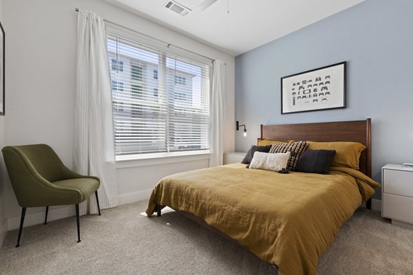 Contemporary bedroom with sleek furnishings at Broadstone Ayrsley Apartments, part of Greystar's luxury apartment offerings