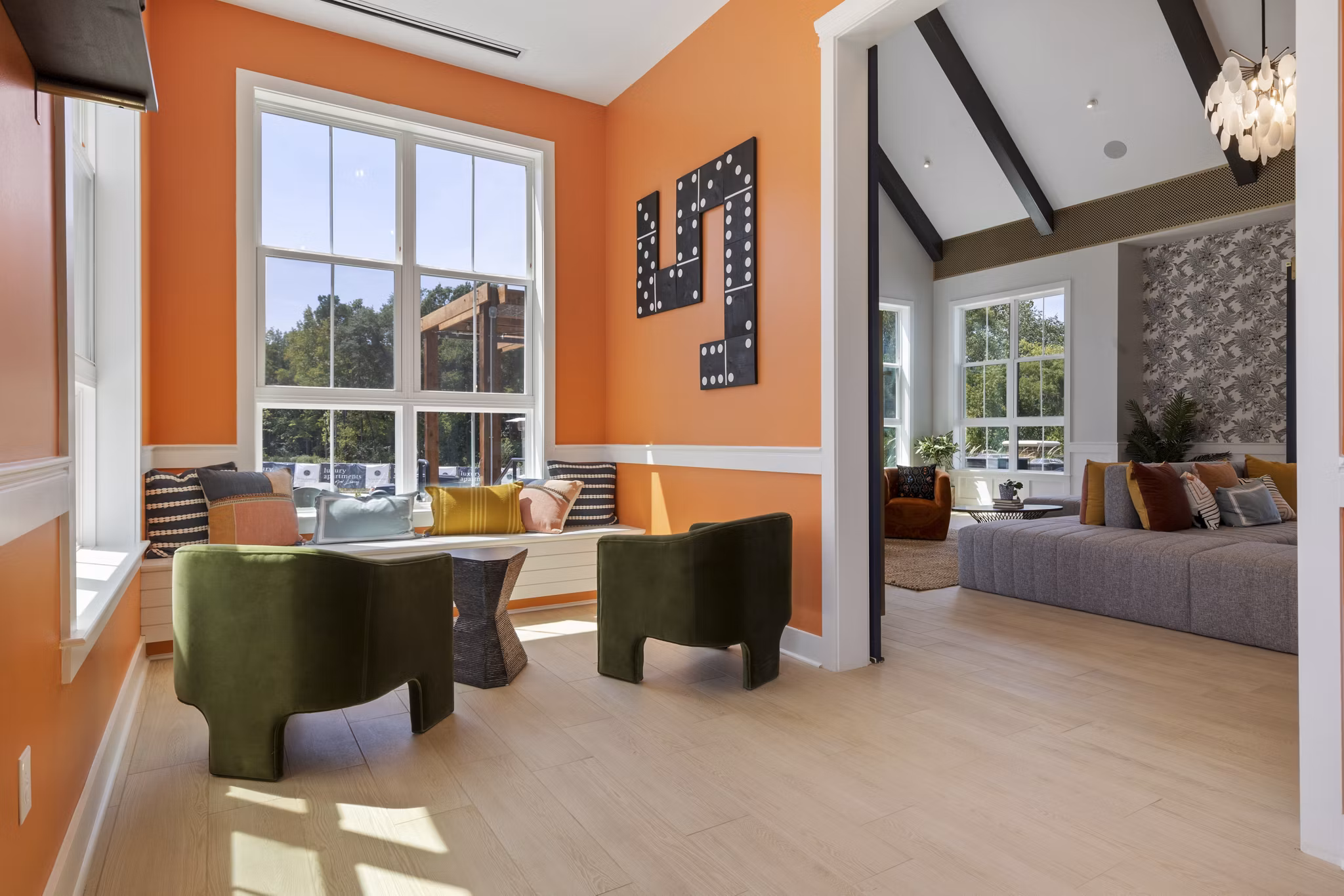 Clubhouse with modern lounge seating and entertainment area at Broadstone Ayrsley Apartments, a Greystar luxury property