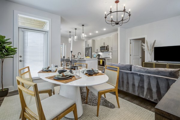 Dining room featuring elegant lighting and modern decor in Broadstone Ayrsley Apartments