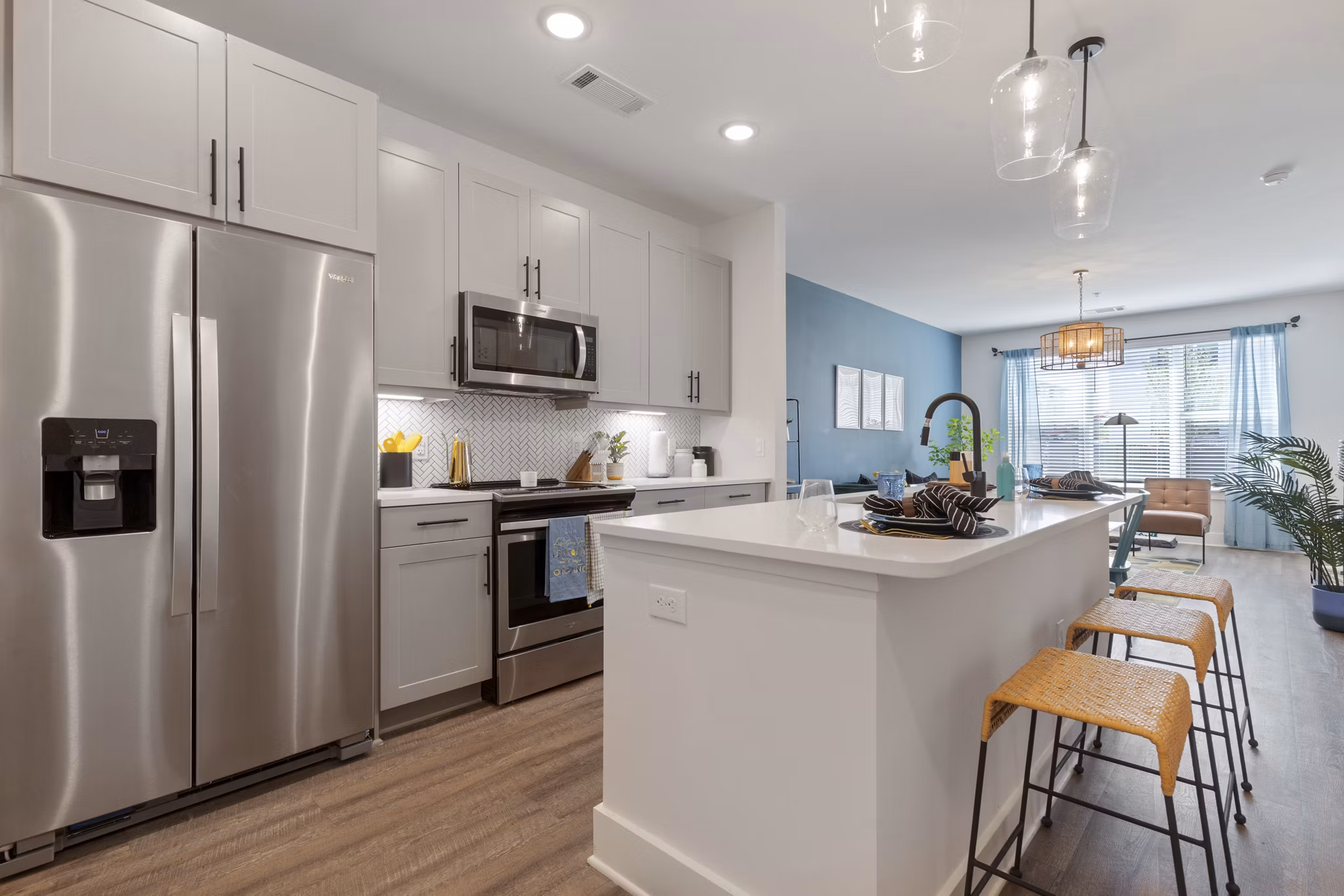 Modern kitchen featuring stainless steel appliances and granite countertops in Broadstone Ayrsley Apartments
