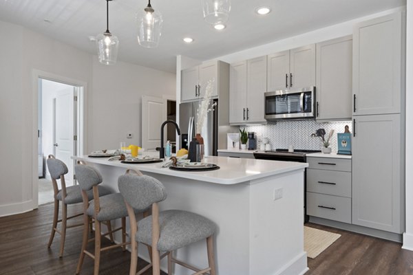 Modern kitchen with stainless steel appliances at Broadstone Ayrsley Apartments, offering luxury living near  training facilities