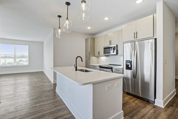 Modern kitchen with stainless steel appliances at Broadstone Ayrsley Apartments Luxury living spaces designed for comfort
