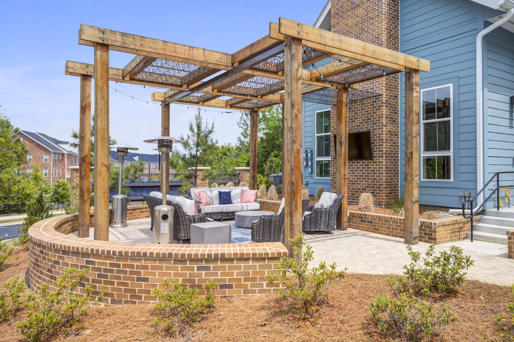 Modern recreational area with trendy seating and green spaces at Broadstone Ayrsley Apartments, ideal for relaxation and socializing