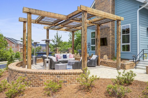 Modern recreational area with trendy seating and green spaces at Broadstone Ayrsley Apartments, ideal for relaxation and socializing