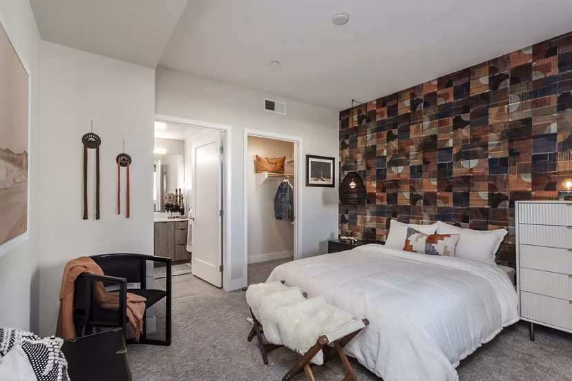 Luxurious bedroom featuring modern furnishings at Prado West Apartments