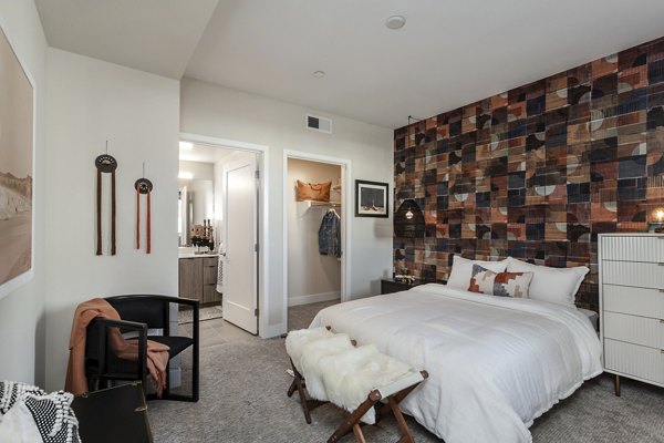 Luxurious bedroom featuring modern furnishings at Prado West Apartments