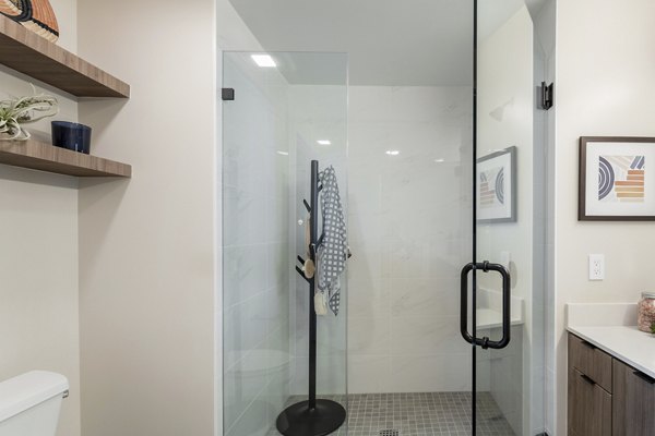 Modern bathroom with marble countertops at Prado West Apartments, offering luxury living in a prime location
