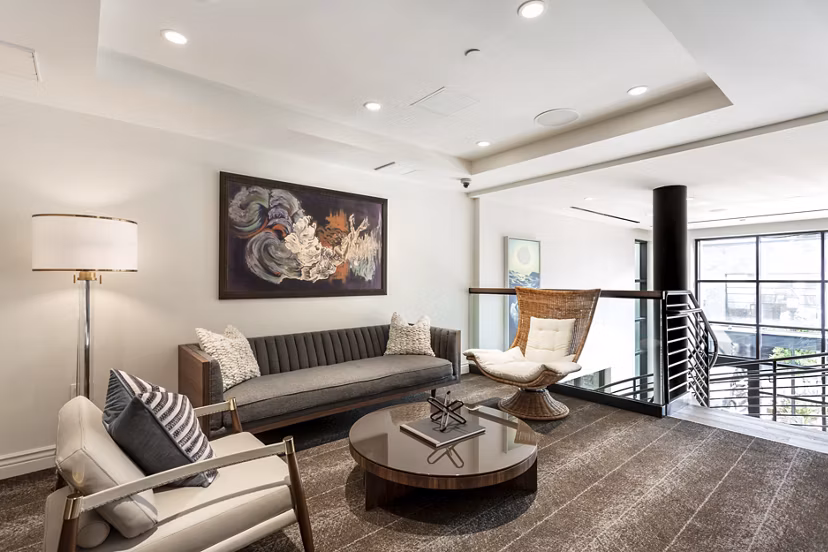 Clubhouse with modern design and comfortable seating at Prado West Apartments, perfect for gatherings and social events