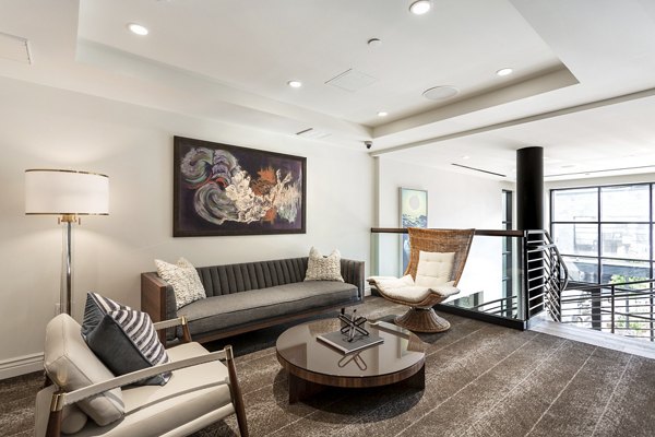 Clubhouse with modern design and comfortable seating at Prado West Apartments, perfect for gatherings and social events